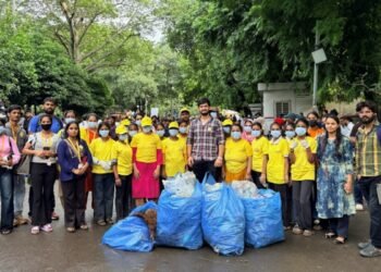 Maid In India Leads Cleanliness Drive at Delhi Protest Site. Yellow T-Shirts, Blue Bags, One Mission.